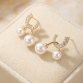 Pearl earring with gold accents